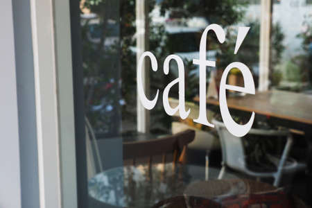 text cafe in front of mirror coffee shopの写真素材