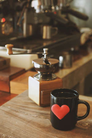 vintage color tone : cup of coffee in coffee shopの写真素材
