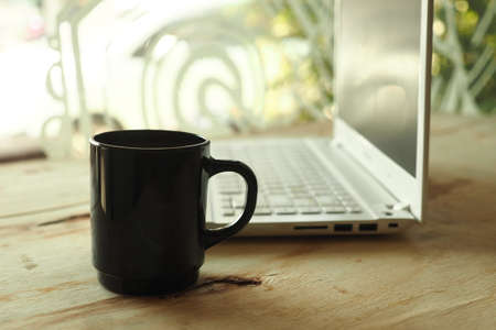 vintage color tone style : cup of coffee in coffee shopの写真素材