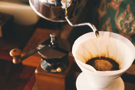 vintage color tone : cup of coffee in coffee shopの写真素材