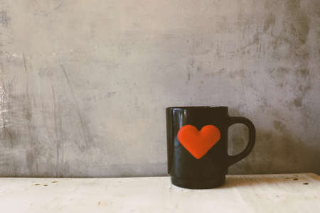 vintage color tone : cup of coffee in coffee shopの写真素材