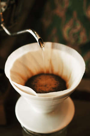 vintage color tone : cup of coffee in coffee shop