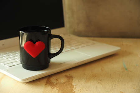 vintage color tone style : cup of coffee in coffee shopの写真素材