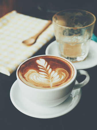 Cup of Coffee in coffee shop vintage color tone styleの写真素材