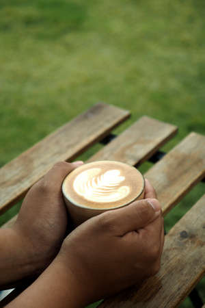 vintage color tone of  cup of coffee  on the table coffee shop