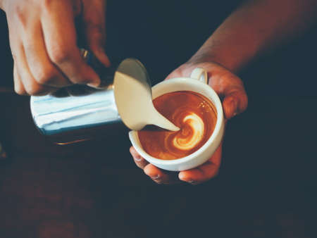 vintage color tone of  cup of coffee latte artの写真素材