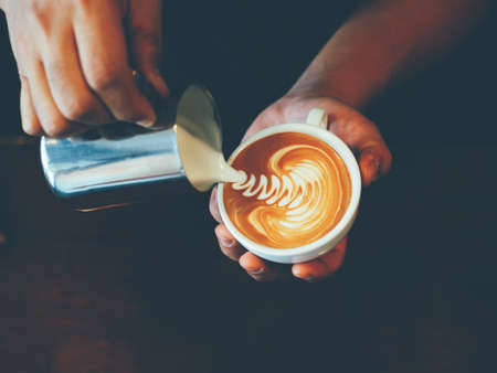 vintage color tone of  cup of coffee latte artの写真素材