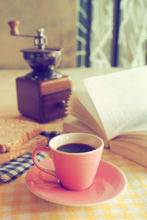 Cup of Coffee in coffee shop vintage color tone styleの写真素材