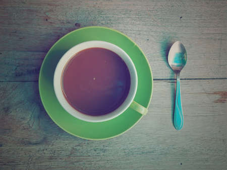 coffee on the wood texture vintage color toneの写真素材