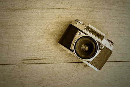 retro film camera on the wood backgroundの写真素材