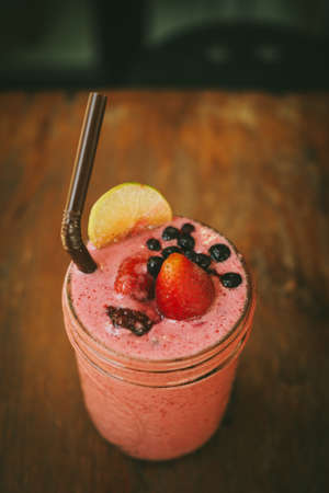 Fresh Blueberry and Strawberry Smoothie on a backgroundの写真素材