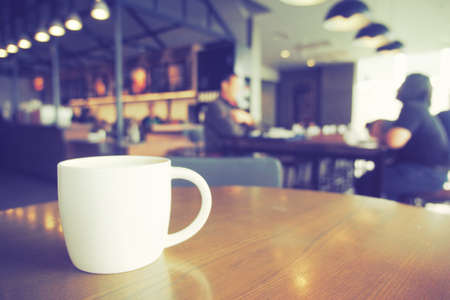 cup of coffee in coffee shop vintage color