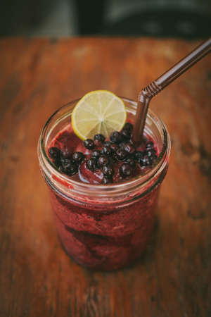 Fresh Blueberry and Strawberry Smoothie on a backgroundの写真素材
