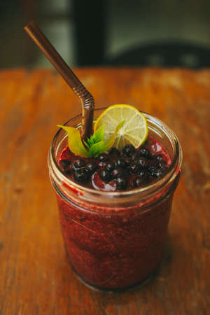 Fresh Blueberry and Strawberry Smoothie on a backgroundの写真素材