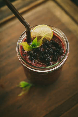 Fresh Blueberry and Strawberry Smoothie on a backgroundの写真素材