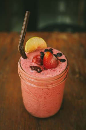 Fresh Blueberry and Strawberry Smoothie on a backgroundの写真素材