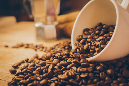 coffee beans on the wood texture vintage color tone