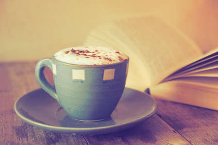 cup of coffee with book  in coffee shop vintage colorの写真素材