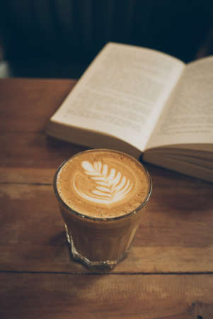coffee latte art on the wood desk vintage colorの写真素材