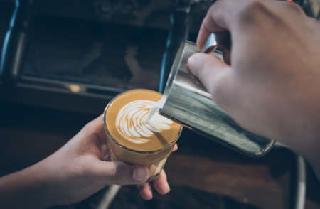 how to make latte art coffee in vintage colorの写真素材