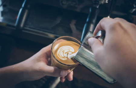 how to make latte art coffee in vintage colorの写真素材
