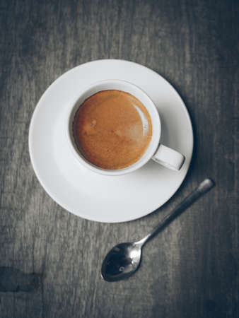 cup of coffee latte on the wood textureの写真素材