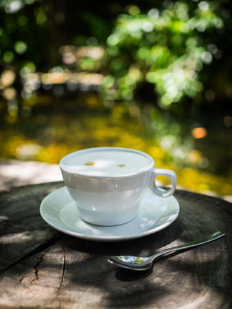 cup of coffee latte on the wood textureの写真素材