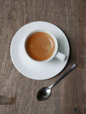 cup of coffee latte on the wood textureの写真素材