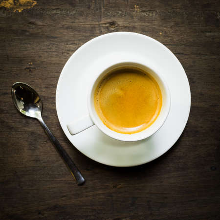 cup of coffee espresso on the wood deskの写真素材