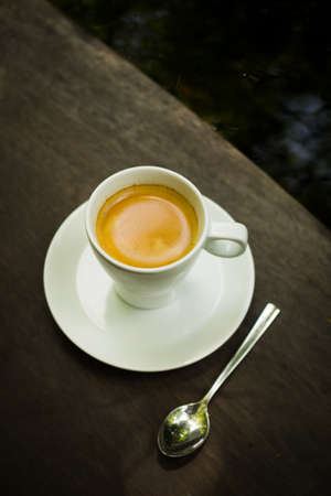 cup of coffee espresso on the wood deskの写真素材