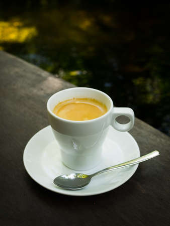 cup of coffee espresso on the wood deskの写真素材