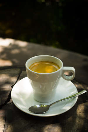 cup of coffee espresso on the wood deskの写真素材