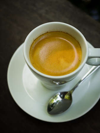 cup of coffee espresso on the wood deskの写真素材