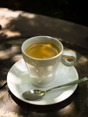 cup of coffee espresso on the wood deskの写真素材
