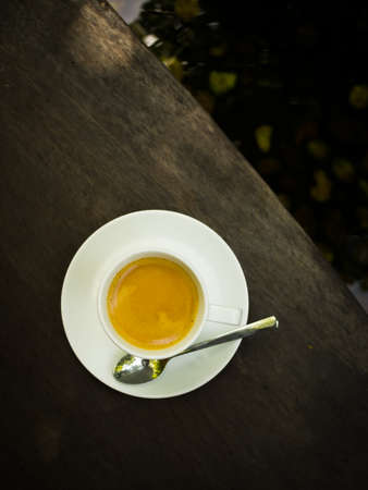 cup of coffee espresso on the wood deskの写真素材