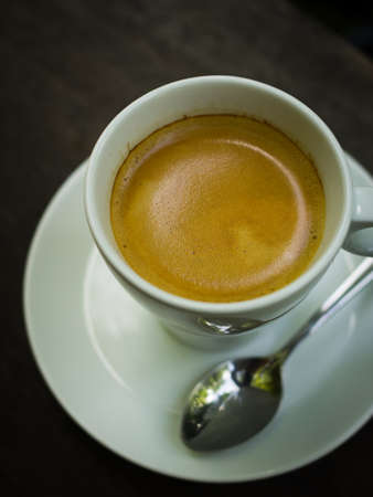 cup of coffee espresso on the wood deskの写真素材