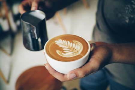 vintage color tone of  cup of coffee latte art