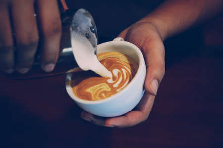 vintage color tone of  cup of coffee latte artの写真素材