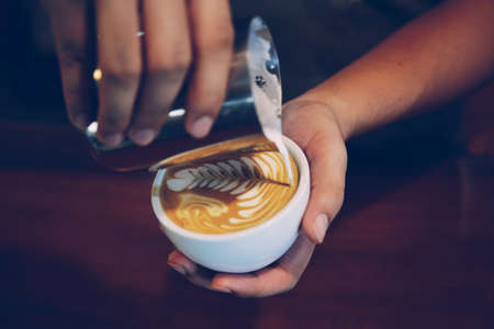 vintage color tone of  cup of coffee latte artの写真素材