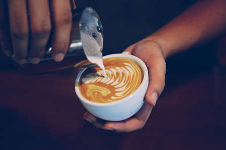 vintage color tone of  cup of coffee latte artの写真素材