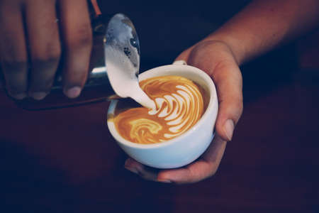 vintage color tone of  cup of coffee latte artの写真素材