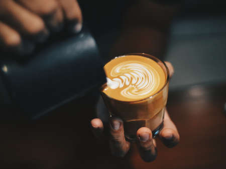 vintage color tone of  cup of coffee latte artの写真素材