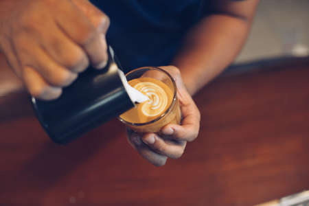 vintage color tone of  cup of coffee latte artの写真素材
