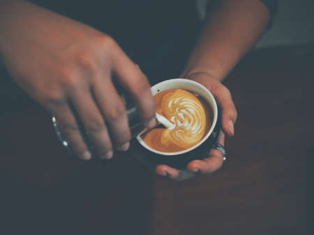 vintage color tone of  cup of coffee latte artの写真素材