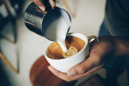 vintage color tone of  cup of coffee latte artの写真素材