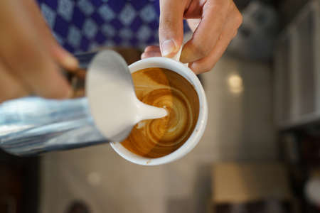 coffee latte art make by baristaの写真素材