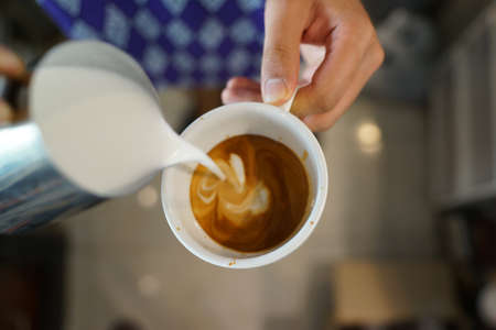 coffee latte art make by baristaの写真素材