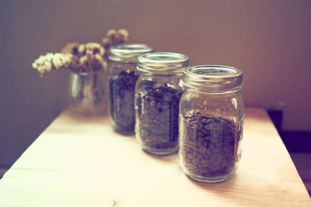 coffee beans in the bottle vintage color toneの写真素材