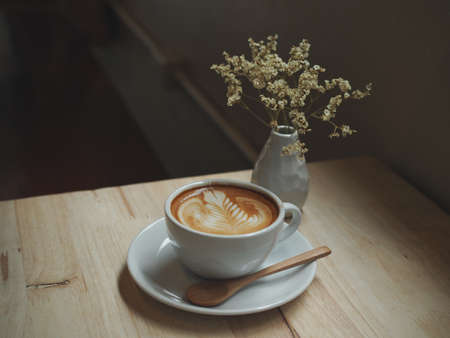 coffee latte art in coffee shop in vintage color toneの写真素材