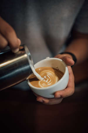 coffee latte art in coffee shop in vintage color toneの写真素材